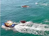  ?? ?? The Department of Conservati­on has concerns over a close encounter between a pod of dolphins and jet ski riders and a drone operator at Sandy Bay.