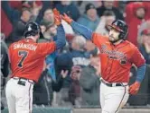  ?? BRYNN ANDERSON/AP ?? Braves’ Travis d’Arnaud, right, celebrates his homer with Dansby Swanson in the eighth inning of Game 3 of the World Series on Friday in Atlanta.