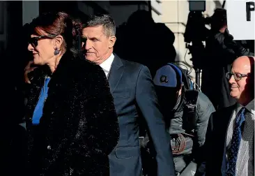  ?? AP ?? President Donald Trump’s former National Security Adviser Michael Flynn, who pleaded guilty to lying to the FBI about his contacts with Russia during the presidenti­al transition, arrives with his wife Lori Andrade, for his sentencing at the US District Court in Washington yesterday.
