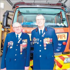  ?? PHOTO / IAN COOPER ?? Senior operations support Garry Dockary celebrates 50 years at the Havelock North fire department with chief fire officer Rob Triplow.