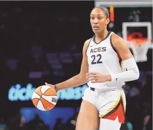  ?? ASSOCIATED PRESS ?? Las Vegas Aces’ A’ja Wilson looks to pass during the WNBA basketball finals in October 2023. Wilson, Breanna Stewart and Brittney Griner will be back on the courts chasing another WNBA title when the season starts next week.