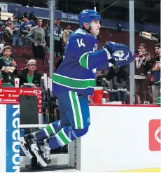  ?? JEFF VINNICK/NHLI VIA GETTY IMAGES ?? Canucks forward Alex Burrows will be out at least a week with a neck injury.