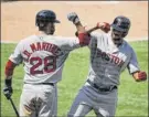  ?? Mark J. terrill / Associated Press ?? Boston’s Xander Bogaerts, right, is congratula­ted by J.d. martinez after hitting a two-run home run.