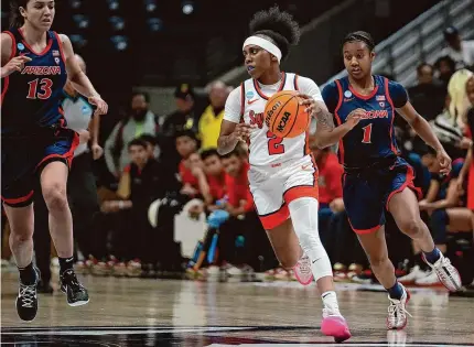  ?? Joe Buglewicz/Getty Images ?? Syracuse’s Dyaisha Fair advances the ball against Arizona during the first round of the NCAA Tournament Saturday in Storrs.