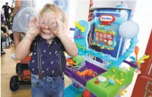  ?? Richard Drew / Associated Press ?? Hutton, 3, plays with Little Tikes Circuit Center at the Walmart Toy Shop event in New York.