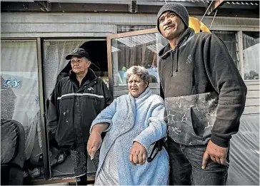  ?? LAWRENCE SMITH/STUFF ?? Monica Hau, Bella Heta and her son Henare Heta outside Bella’s home. ‘‘If it’s raining you cover up [the leak], do a bubble-gum patchwork until the next one comes along, that’s how it works,’’ Henare says.
