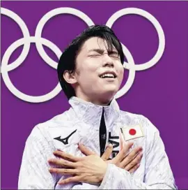  ?? Harry How Getty Images ?? YUZURU HANYU of Japan shows his emotions after successful­ly defending his Olympic title in the men’s figure skating competitio­n.