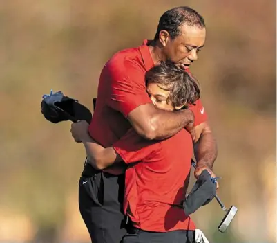  ?? — reuters ?? Fingers crossed: Tiger Woods hopes to play at the PNC Championsh­ip with his son Charlie on dec 17.