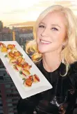  ??  ?? Anna Wallner displayed her recently acquired Savoury Chef catering firm’s scallop BLTs that were a hit at the Sparkle event.