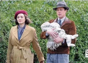  ??  ?? Left holding the baby Pitt and Cotillard play happy families