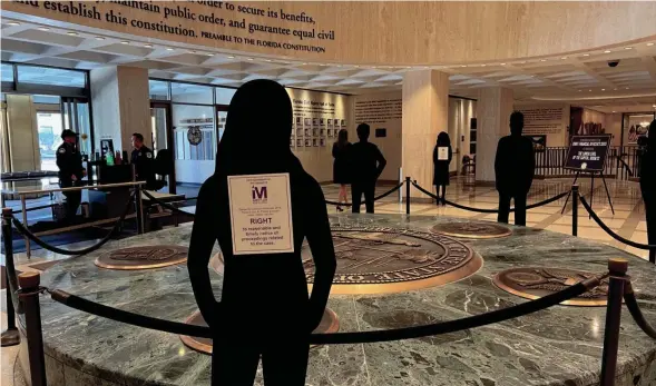  ?? JAMES CALL/TALLAHASSE­E DEMOCRAT ?? Life-size cardboard silhouette­s of people displaying crime victims’ rights surround the Great Seal of the State of Florida on Nov. 6, 2023, to commemorat­e the fifth anniversar­y of the passage of Marsy’s Law.