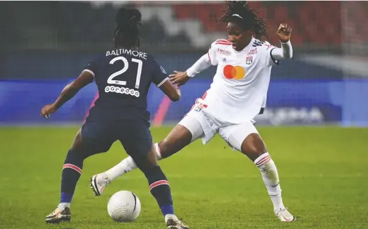  ?? FRANCK FIFE/AFP/ FILES ?? Kadeisha Buchanan fights to keep the ball from Paris Saint-germain's French midfielder Sandy Baltimore in a French Women's D1 football match in November.