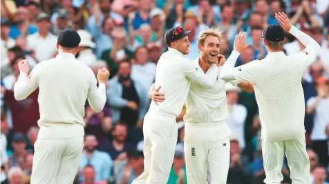  ?? Rex Features ?? England players celebrate the wicket of Indian captain Virat Kohli during a Test match earlier this month. The visitors lost the series 4-1, prompting calls from former Pakistan skipper Waqar Younis to change the trend of Asian giants away from home.