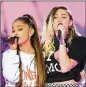  ?? DAVE HOGAN VIA AP ?? Singers Ariana Grande (left) and Miley Cyrus perform in concert in Manchester, England, on Sunday.