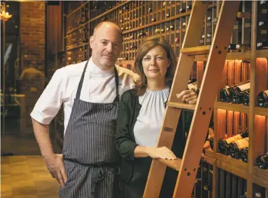  ?? John Storey / Special to The Chronicle ?? Michael and Lindsay Tusk of San Francisco’s Quince plan to open their Verjus wine bar in late summer. Verjus will have a retail shop selling wine products and kitchenwar­e that takes up about half the space.