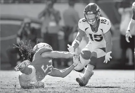  ?? Harry How Getty Images ?? CHARGERS SAFETY Jahleel Addae, left, tries to pick off a deflected pass intended for Denver Broncos receiver Hunter Sharp.