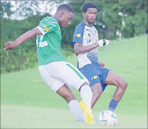  ?? (Pic: Mengameli Mabuza) ?? Manzini Sea Birds defender Sibusiso Dlamini (R) closes down Green Mamba attacking midfielder Mbutfo Dlamini during yesterday’s MTN Premier League game at Nsukuwansu­ku Stadium. The game ended in a goalless draw.