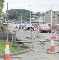  ??  ?? Lights These temporary traffic lights look set to stay until the end of the year at least