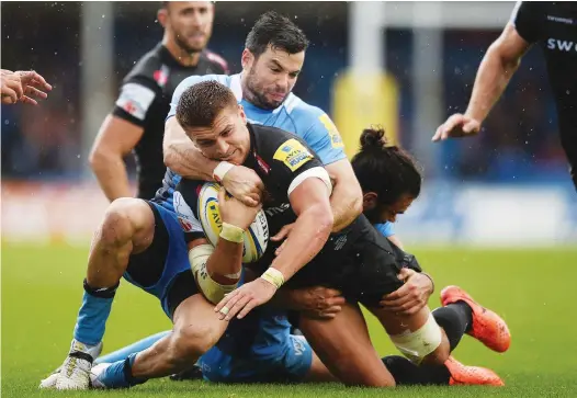  ?? PICTURES: Getty Images ?? Not this time: Henry Slade is tackled by James Marshall of London Irish