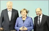  ?? PICTURE: AP/AFRICAN NEWS AGENCY (ANA) ?? German Chancellor Angela Merkel is flanked by Bavarian governor Horst Seehofer, left, and Social Democratic Party chairperso­n Martin Schulz after talks yesterday on forming a new German government in Berlin.