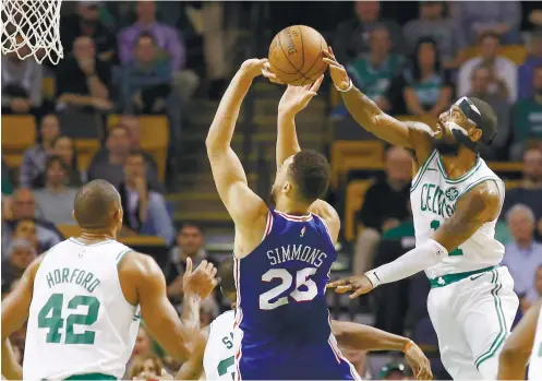  ?? AP FOTO ?? MEAN SCORING MACHINE. Boston Celtics’ Kyrie Irving (right) proves that he is a potent scoring weapon for the Celtics after finishing with 36 in their win over Philadelph­ia.