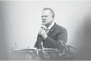  ?? Brynn Anderson / Associated Press ?? Former Alabama Chief Justice and Republican U.S. Senate candidate Roy Moore speaks Tuesday at a revival Tuesday in Jackson, Ala.