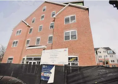  ?? Brian A. Pounds/Hearst Connecticu­t Media ?? The River Breeze apartment complex under constructi­on at 223 Canal St., one of many recent housing developmen­ts in Shelton on Friday, Jan. 14, 2021.