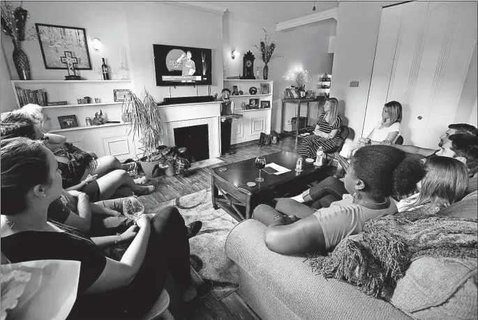  ?? [FRED SQUILLANTE PHOTOS/DISPATCH] ?? Tyler Young hosts guests at his Upper Arlington apartment to watch a worship service from Crossroads, a Cincinnati church that he attended when he lived there years ago. About 60 people in the Columbus area watch a live stream each week, either at...
