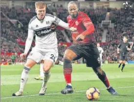  ?? AFP ?? Manchester United's Romelu Lukaku (right) is challenged by Fulham’s Alfie Mawson on Saturday.