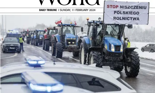  ?? WOJTEK RADWANSKI/AGENCE FRANCE-PRESSE ?? BANNER reading ‘Stop destroying the Polish agricultur­e’ is seen on one of tractors blocking access to the Polish-Ukrainian border crossing in Dorohusk, eastern Poland, during a farmers’ protest across the country against European Union politics and Ukrainian agricultur­al products allowed on EU market at low prices.