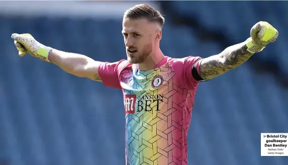  ?? Nathan Stirk/ Getty Images ?? > Bristol City goalkeeper Dan Bentley