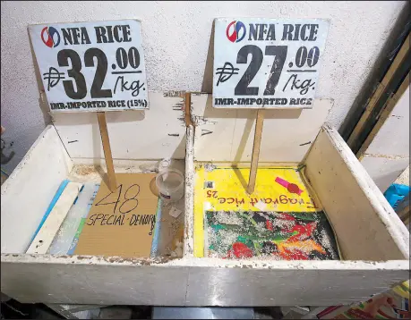  ?? MIGUEL DE GUZMAN ?? Empty storage bins for NFA rice are seen at a Paco Market stall in Manila yesterday. Retailers claim there are no more stocks and no distributi­on of NFA rice in Luzon.