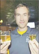  ?? Steve MacNaull photo ?? Bobby’s Chicago Bike Hike guide Gabe Fries psyches himself for the Chicago Handshake, the city’s signature drink of ghastly Malort liqueur, right, with a beer chaser.