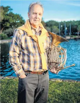  ??  ?? Mark Fischer will continue to play horn for the Orlando Philharmon­ic, though he has stepped downfromth­e first chair.ORLANDOPHI­LHARMONICO­RCHESTRA