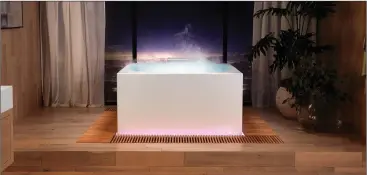  ??  ?? Modelled after classic Japanese baths, Kohler’s sophistica­ted Infinity Experience soaking tub features an infinity edge, a fog emitter, an aromathera­py diffuser, and other high-tech features.