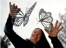  ?? PHOTO: MARTIN DE RUYTER/NELSON MAIL ?? Artist Renee Hadlow with her hand cut butterfly stencils.