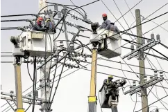  ?? —RICHARD A. REYES ?? CABLE WORK Linemen replace cables on electric posts on UN Avenue in Manila in this photo taken on June 19. The country’s grid operator on Monday warned of insufficie­nt power supply in Luzon due to the tripping of several power plants.