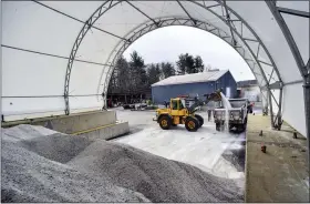  ?? KRISTOPHER RADDER — THE BRATTLEBOR­O REFORMER VIA AP ?? Crews from Brattlebor­o, Vt., Public Works Department loads up plow trucks with road salt on Wednesday before the start of the winter storm that was forecast to hit the area Wednesday night and today.