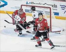  ?? JULIE JOCSAK
THE ST. CATHARINES STANDARD ?? Niagara goaltender Stephen Dhillon defends the net against Guelph’s Nick Suzuki Thursday night at Meridian Centre in St. Catharines.