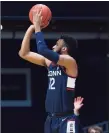  ?? UConn Athletics / Contribute­d ?? UConn’s Tyler Polley shoots a 3-pointer against Butler on Saturday.