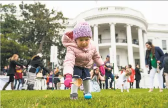  ?? Doug Mills / New York Times ?? A girl takes part in the annual White House Easter Egg Roll in Washington. The White House expected nearly 30,000 adults and children to stream through the gates for the all-day event.