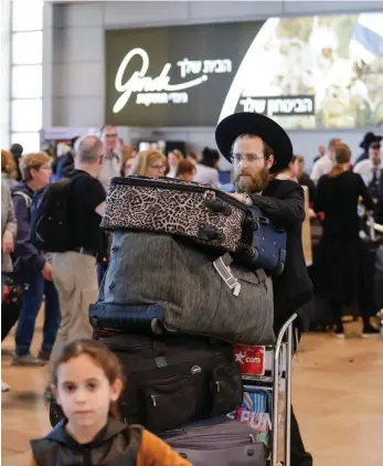  ?? Getty; WhatsApp ?? Disruption at Israel’s Ben Gurion Airport is a show of strength, says Peter Lerner, left, Histadrut internatio­nal director