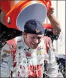  ?? AP/BOB BRODBECK ?? Dale Earnhardt Jr. smiles while taking the ice bucket challenge after practice for the NASCAR Sprint Cup Series auto race at Michigan Internatio­nal Speedway in Brooklyn, Mich.