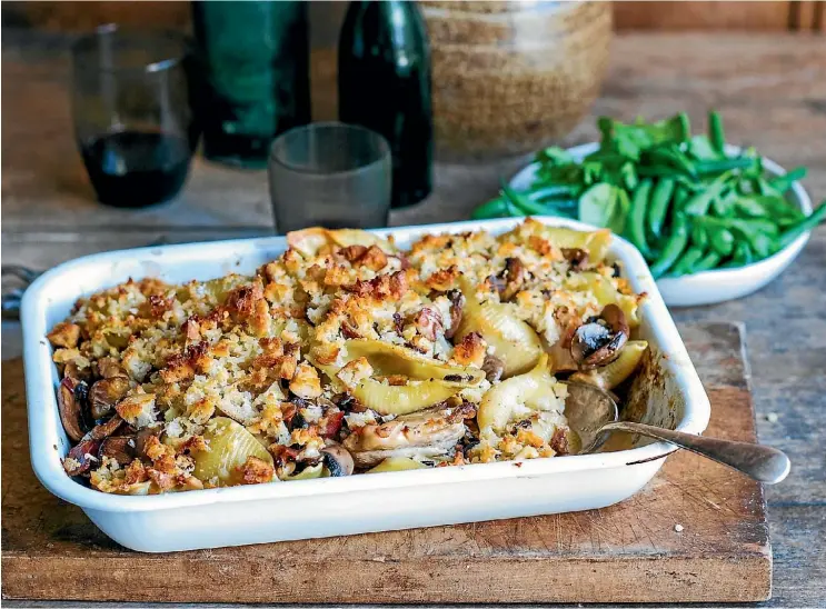  ?? SARAH TUCK ?? Serve this chicken and mushroom pasta bake with crunchy parmesan crumb with herby green beans.