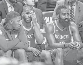 ?? Michael Ciaglo / Houston Chronicle ?? Guards Chris Paul, center, and James Harden, right, watch the end of the Rockets’ 16-point loss from the bench Saturday night.