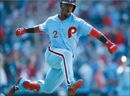  ?? MATT SLOCUM — THE ASSOCIATED PRESS ?? Philadelph­ia Phillies’ Jean Segura celebrates after hitting a game-winning three-run home run off New York Mets relief pitcher Edwin Diaz during the ninth inning of a baseball game, Thursday in Philadelph­ia. Philadelph­ia won 6-3.