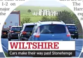  ?? ?? WILTSHIRE
Cars make their way past Stonehenge