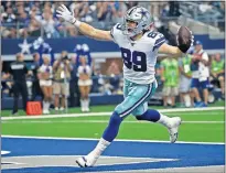  ?? [AP PHOTO/RON JENKINS] ?? Dallas tight end Blake Jarwin, who played at Oklahoma State and Tuttle High School, celebrates catching a pass from quarterbac­k Dak Prescott for a touchdown in the Cowboys' win over the New York Giants in Arlington, Texas on Sunday.
