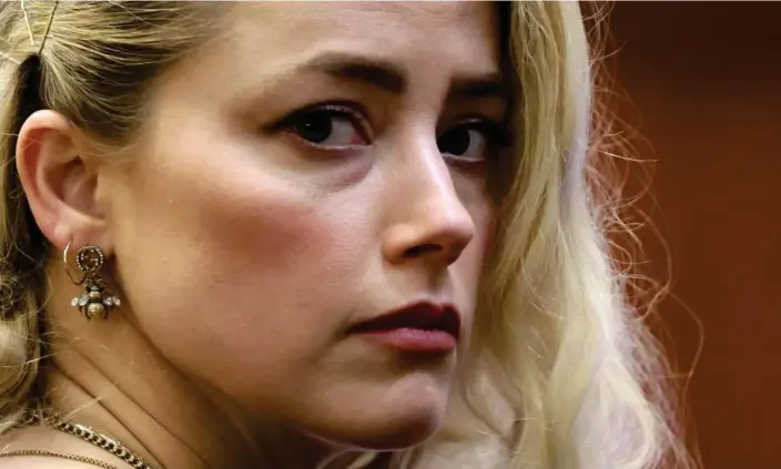  ?? Photograph: Evelyn Hockstein/AFP/Getty Images ?? Amber Heard waits for the verdict in Fairfax, Virginia, on Wednesday.