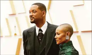  ?? Mike Coppola / TNS ?? Alopecia areata burst into the public consciousn­ess at the Academy Awards ceremony March 27 when actor Will Smith slapped host Chris Rock after Rock made a joke about Smith’s wife, Jada Pinkett Smith, about her lack of hair. Pinkett Smith suffers from alopecia areata.